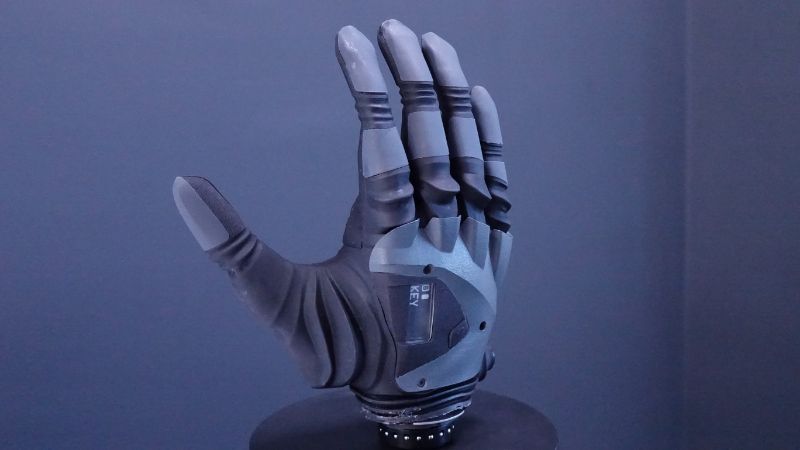A closeup photo of the COVVI Hand with the Titan Grey covers on